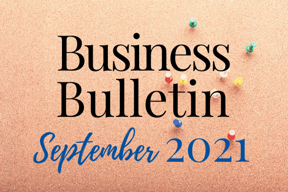cork board with pins pushed in and words reading business  bulletin september 2021