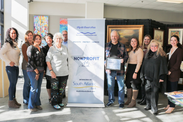 Seacoast Artists Gallery members pose for picture with award plaque