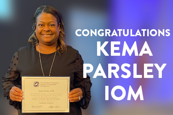 kema parsley smiles with graduation certificate