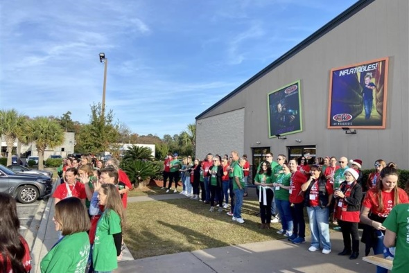 Substitutes for Santa volunteers await students outside the Fun Warehouse in Surfside Beach, S.C.,  