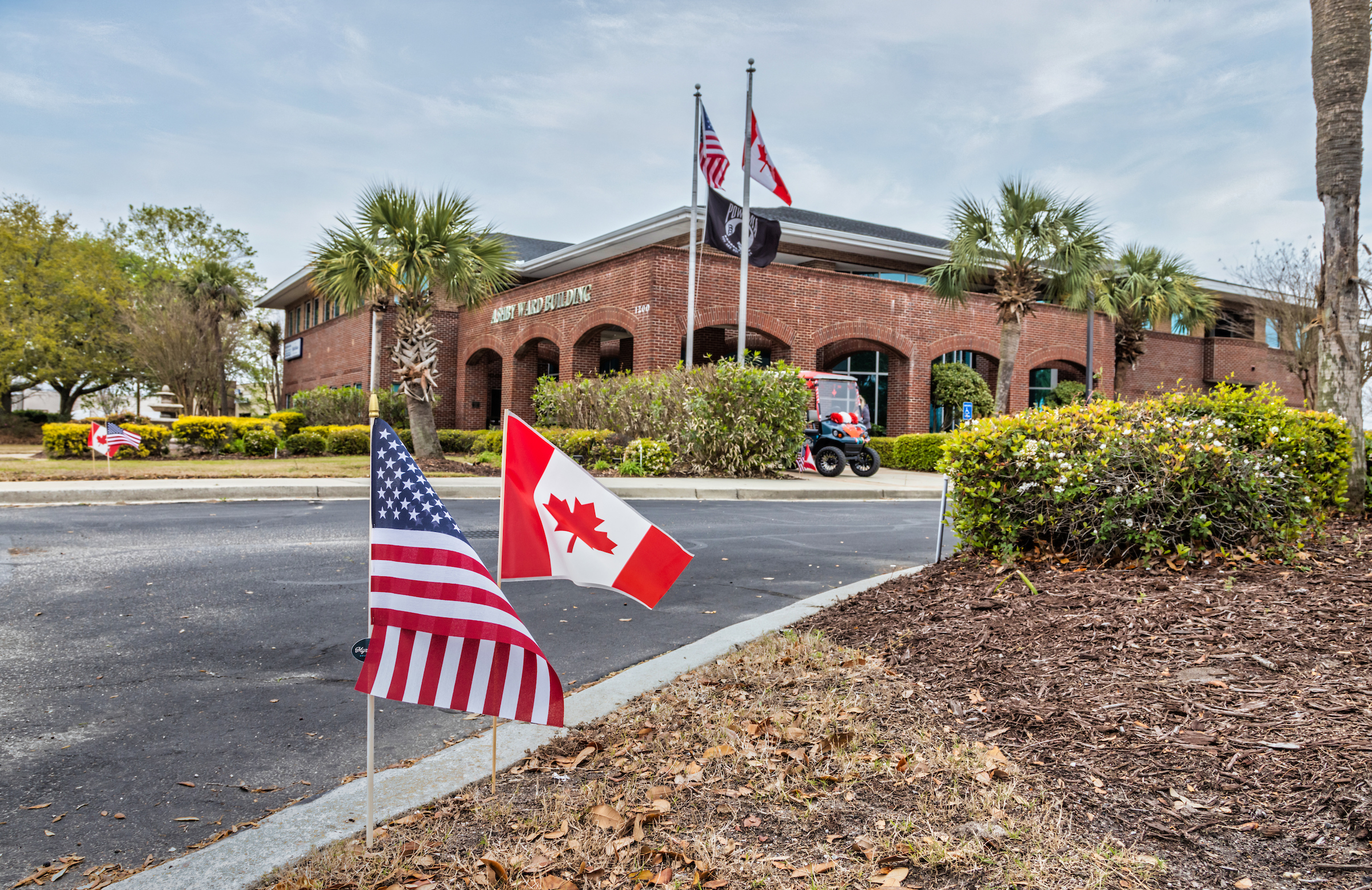 Myrtle Beach Area Chamber of commerce Building with american and canadian flags 