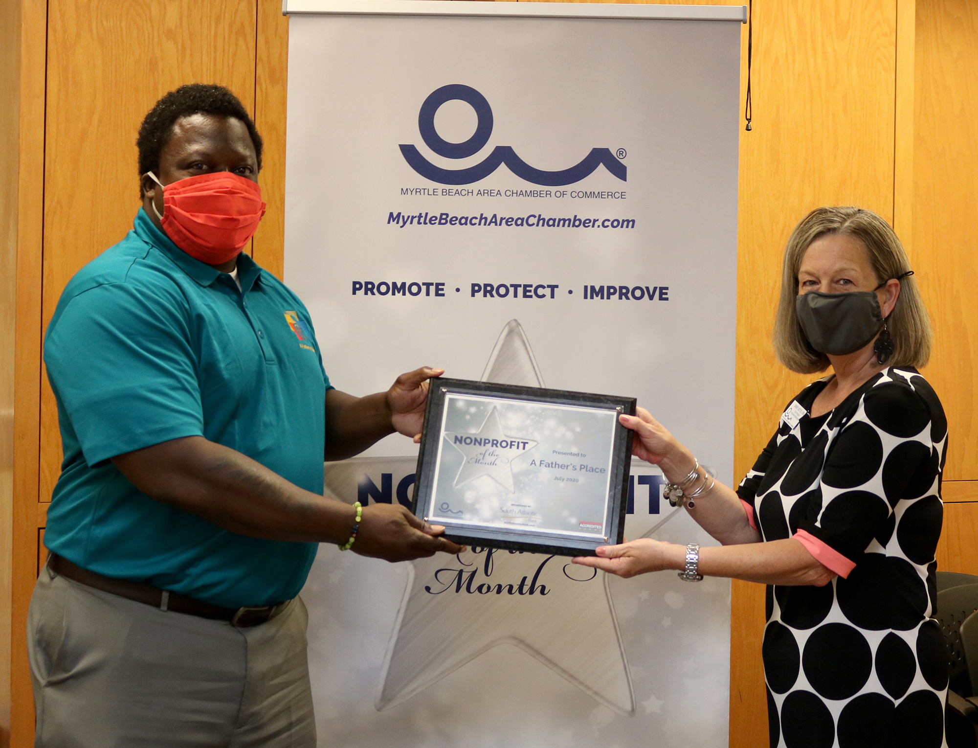 a father's place presented with nonprofit of the month award